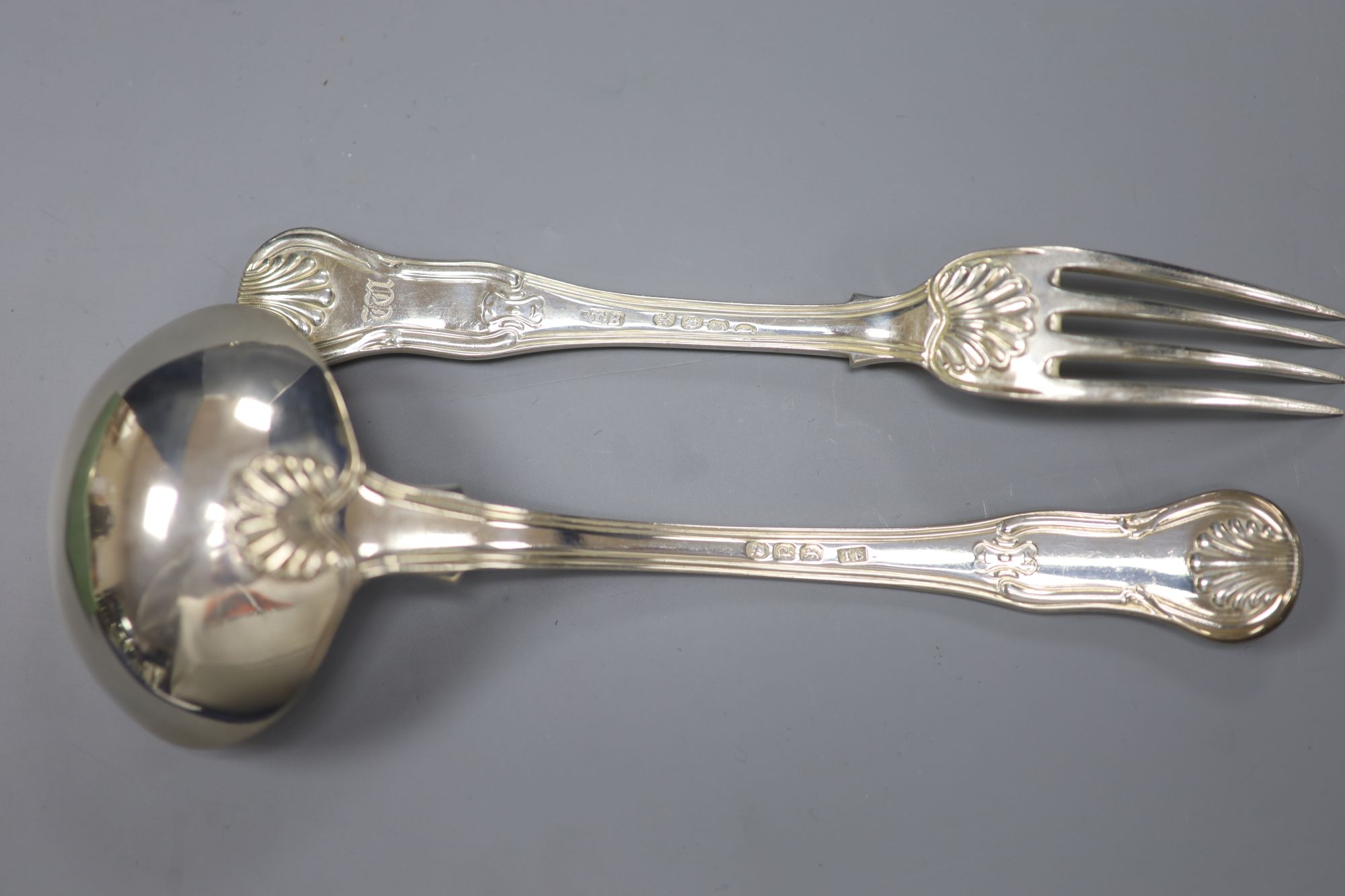 A set of six George III hourglass pattern dessert forks and a pair of sauce ladles, Thomas Wilkes Barker, London, 1818/9 16.8oz.